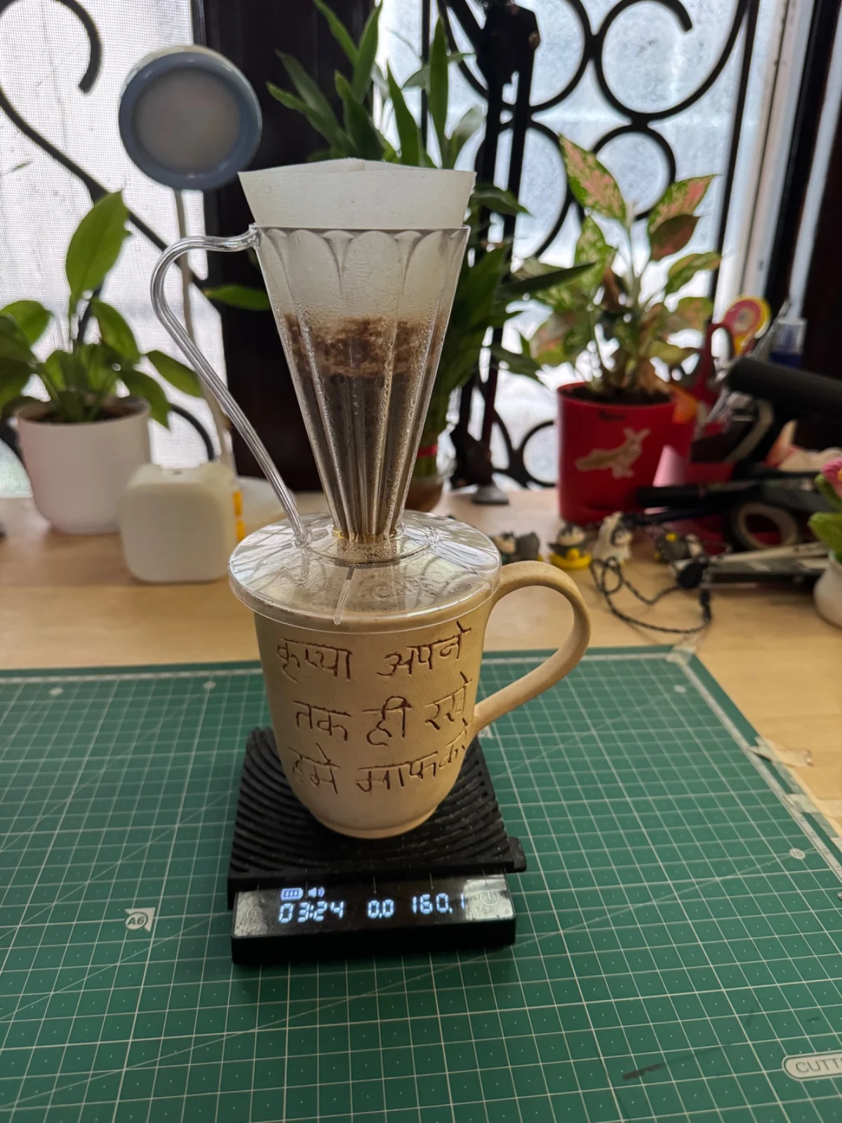 CAFEC Deep 27 brewing into a mug on a digital scale